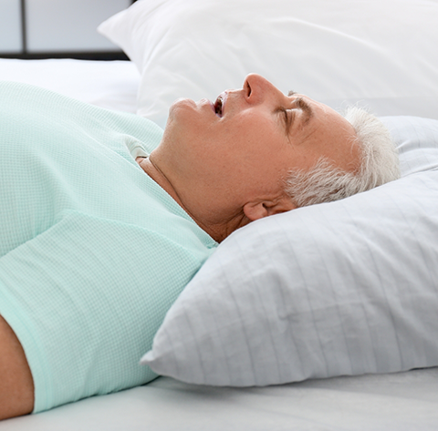 Man sleeping with his mouth open before obstructive sleep apnea treatment in North Olmsted