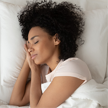 Woman sleeping peacefully on her side