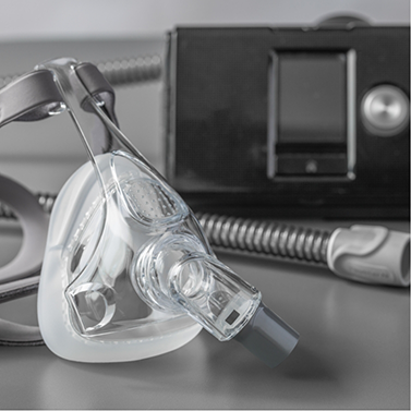 CPAP machine with a mask attached to it
