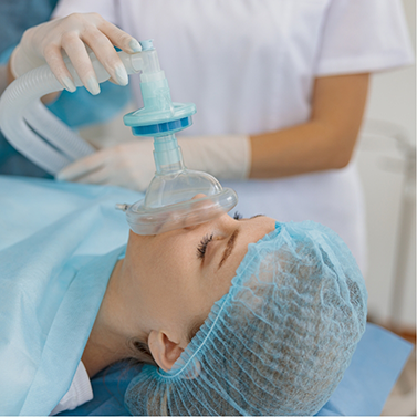 Woman being sedated prior to surgery